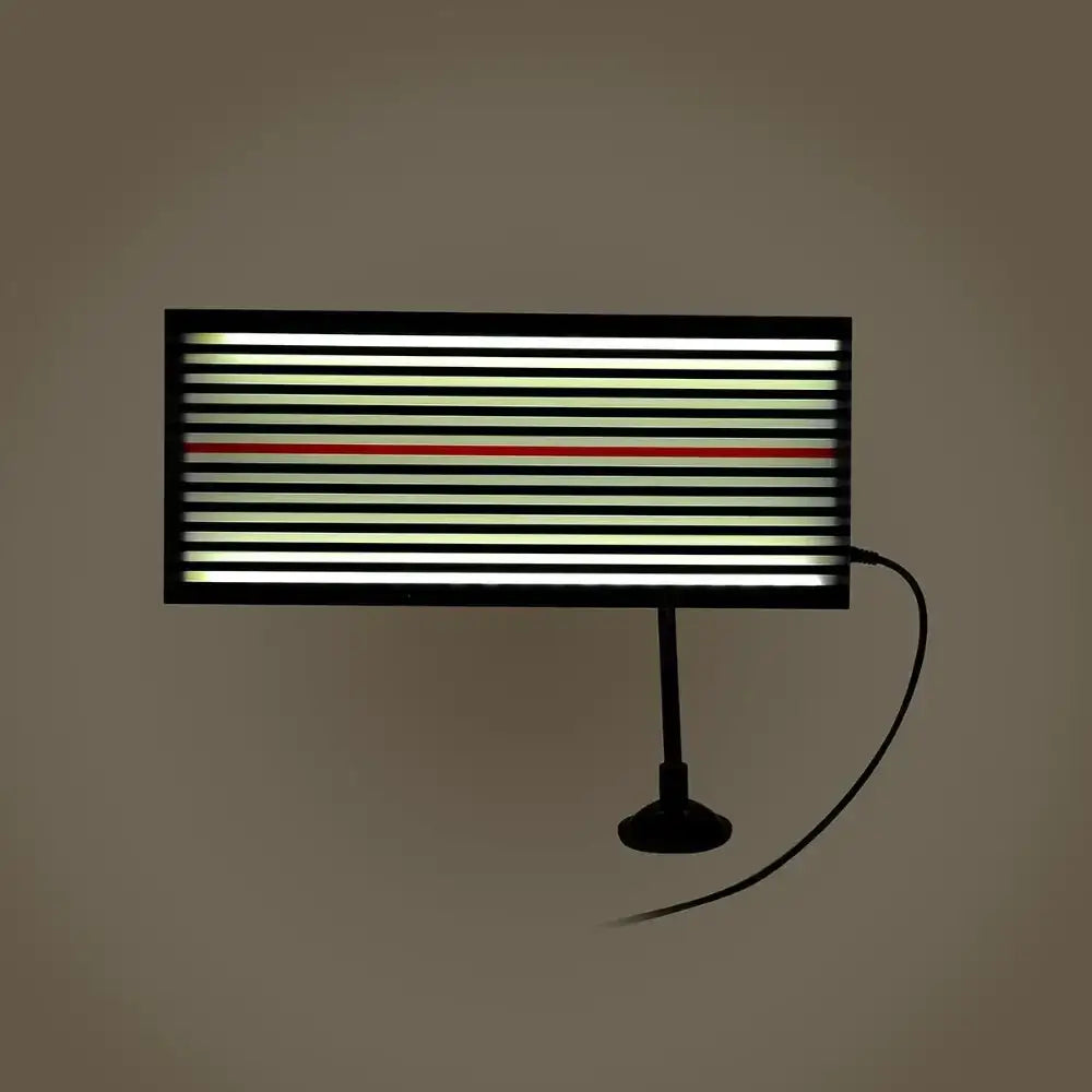Black-framed led light panel with horizontal stripes of white and green illumination, featuring a single red stripe for contrast.
