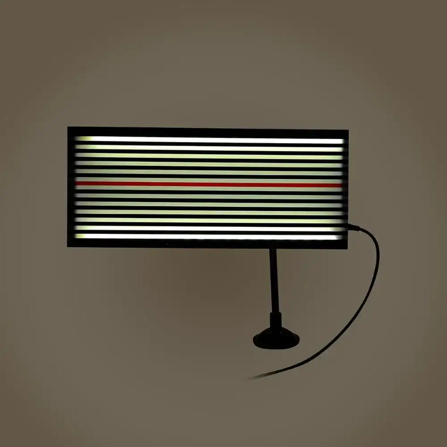 Black-framed led light panel with horizontal stripes of white and green illumination, featuring a single red stripe for contrast.