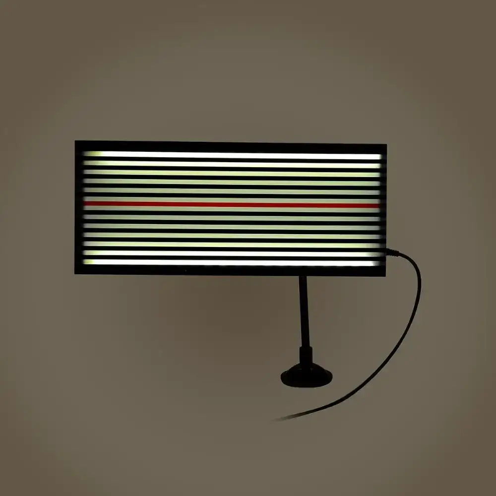 Black-framed led light panel with horizontal stripes of white and pale green illumination, featuring a single red stripe centered among them.