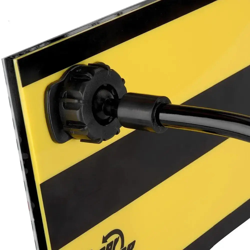 Black plastic pipe clamp securing a black hose to a yellow and black striped panel.