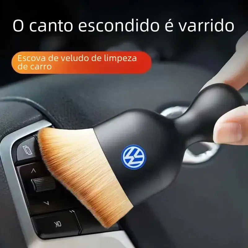 Black volkswagen-branded car interior cleaning brush with soft, light brown bristles.