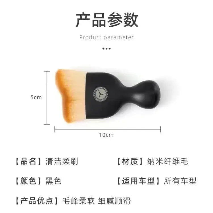 Black mercedes-benz-branded car cleaning brush with soft, orange-tipped nano-fiber bristles.
