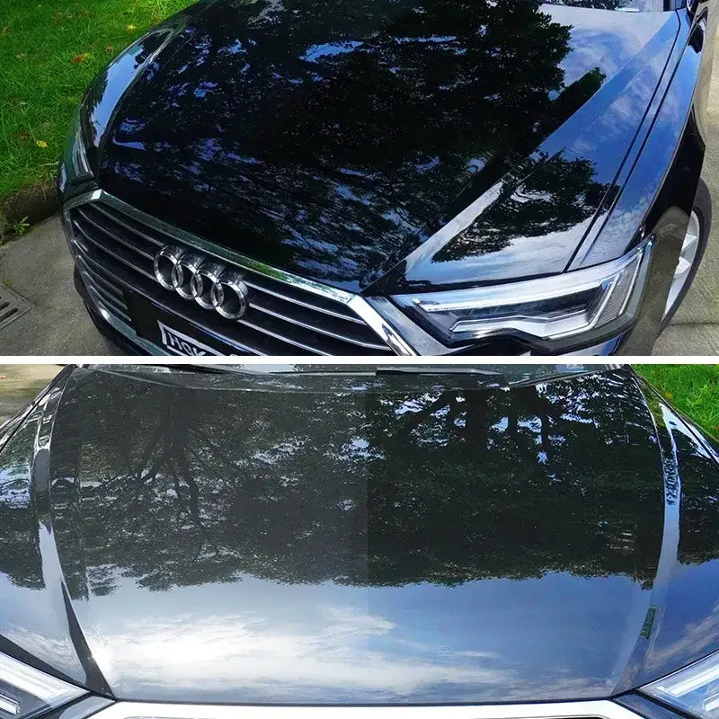 Shiny black audi sedan with a glossy finish and chrome accents.
