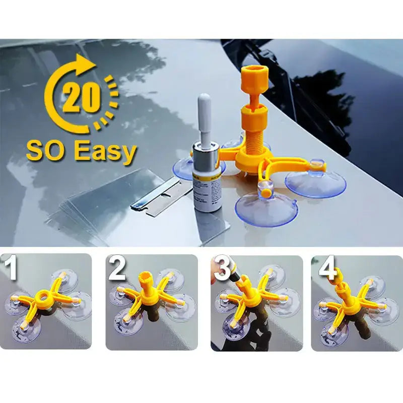 Yellow plastic suction cup window glass removal tool with transparent silicone cups and a silver-tipped adhesive applicator.