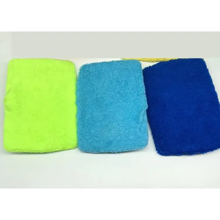 Three microfiber cleaning cloths in neon green, light blue, and dark blue are neatly arranged side by side.