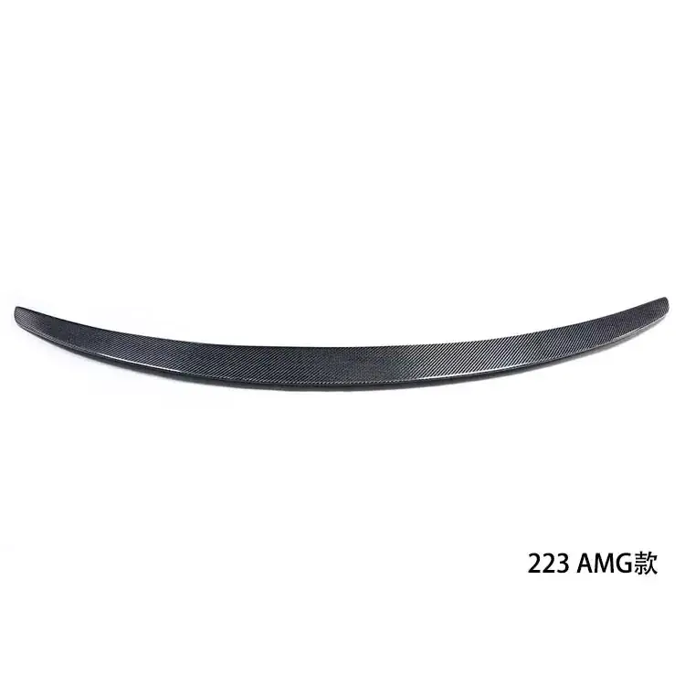 Black carbon fiber rear spoiler with a sleek, curved design and textured weave pattern.