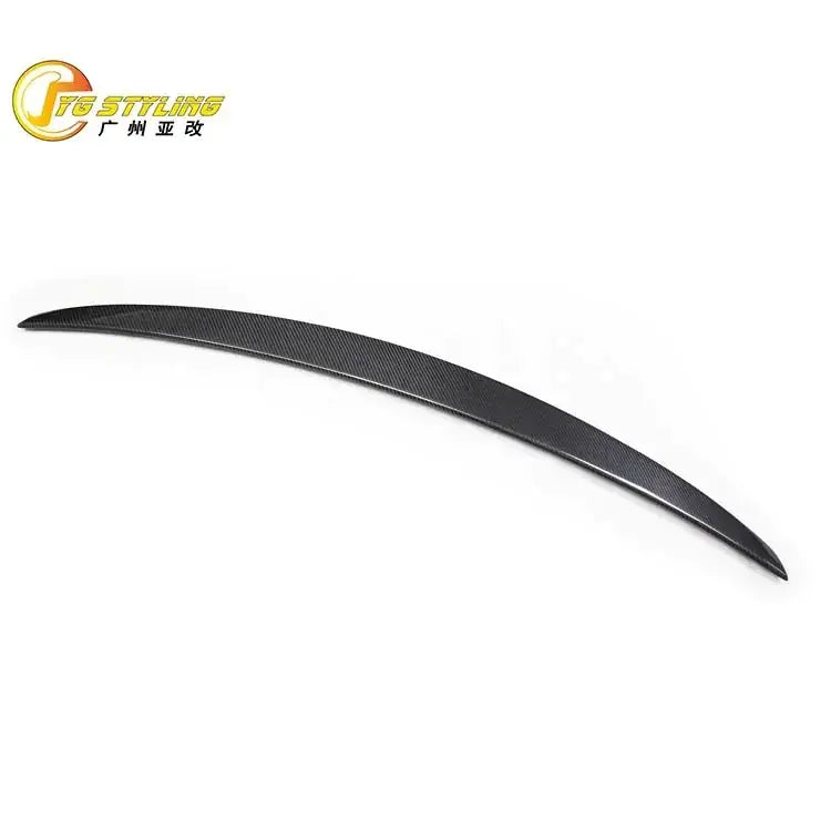 Black carbon fiber rear trunk spoiler with a sleek, curved design.