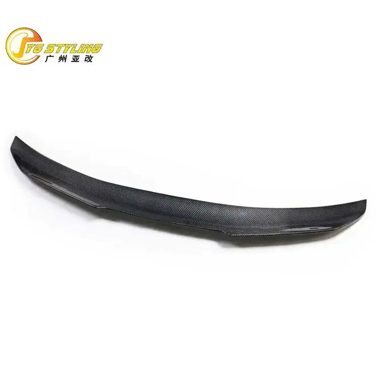 Black carbon fiber rear spoiler with a sleek, curved design.