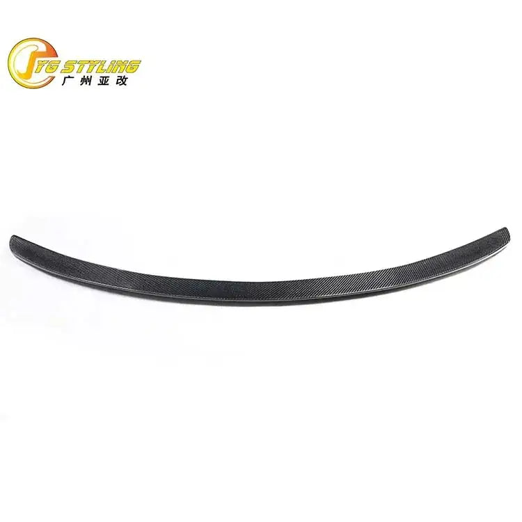 Black carbon fiber rear spoiler with a sleek, curved design.