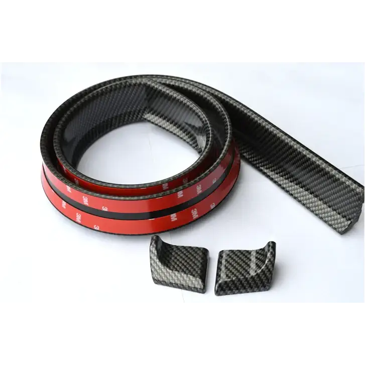 Carbon fiber trim strip with red adhesive backing and matching corner pieces.