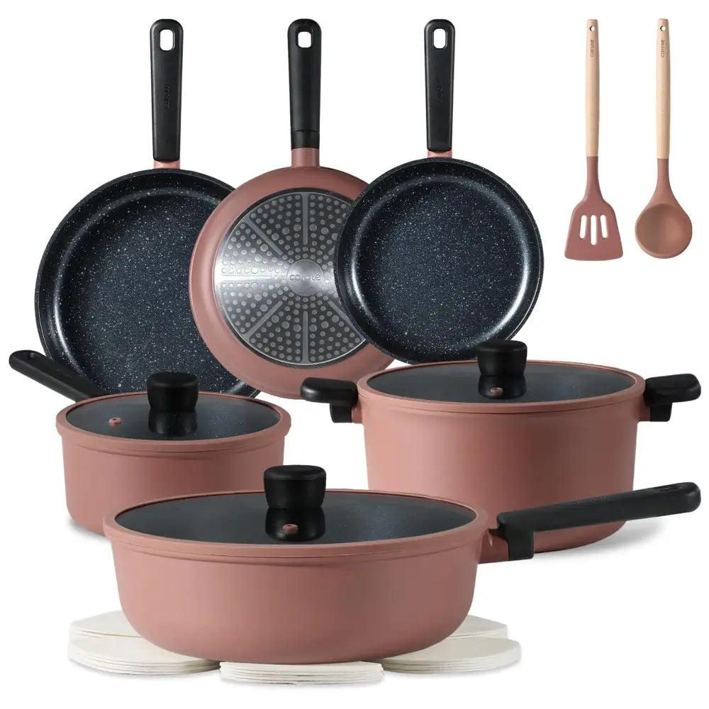 Rose gold non-stick cookware set with black handles and lids, featuring a speckled finish on the pans.