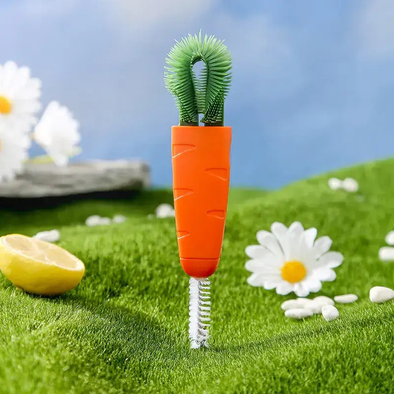 Orange carrot-shaped cleaning brush with green bristles and a white spiral brush head