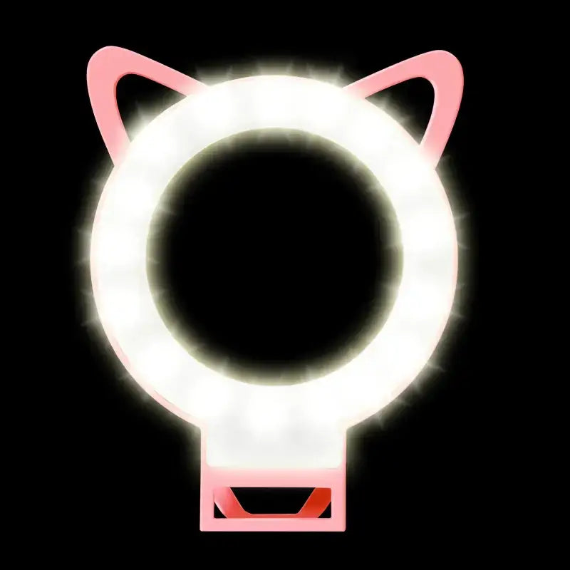Pink cat-ear shaped ring light with glowing white led illumination.