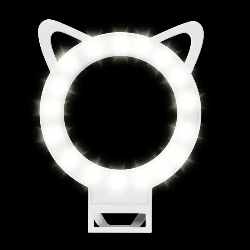 White cat-ear shaped ring light with led bulbs glowing brightly around its circular frame.