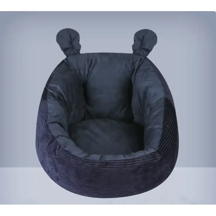 Dark gray corduroy pet bed with soft, plush interior and two rounded ear-like attachments on top.