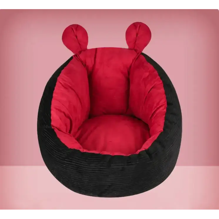 Red and black corduroy ladybug-shaped pet bed with plush interior.