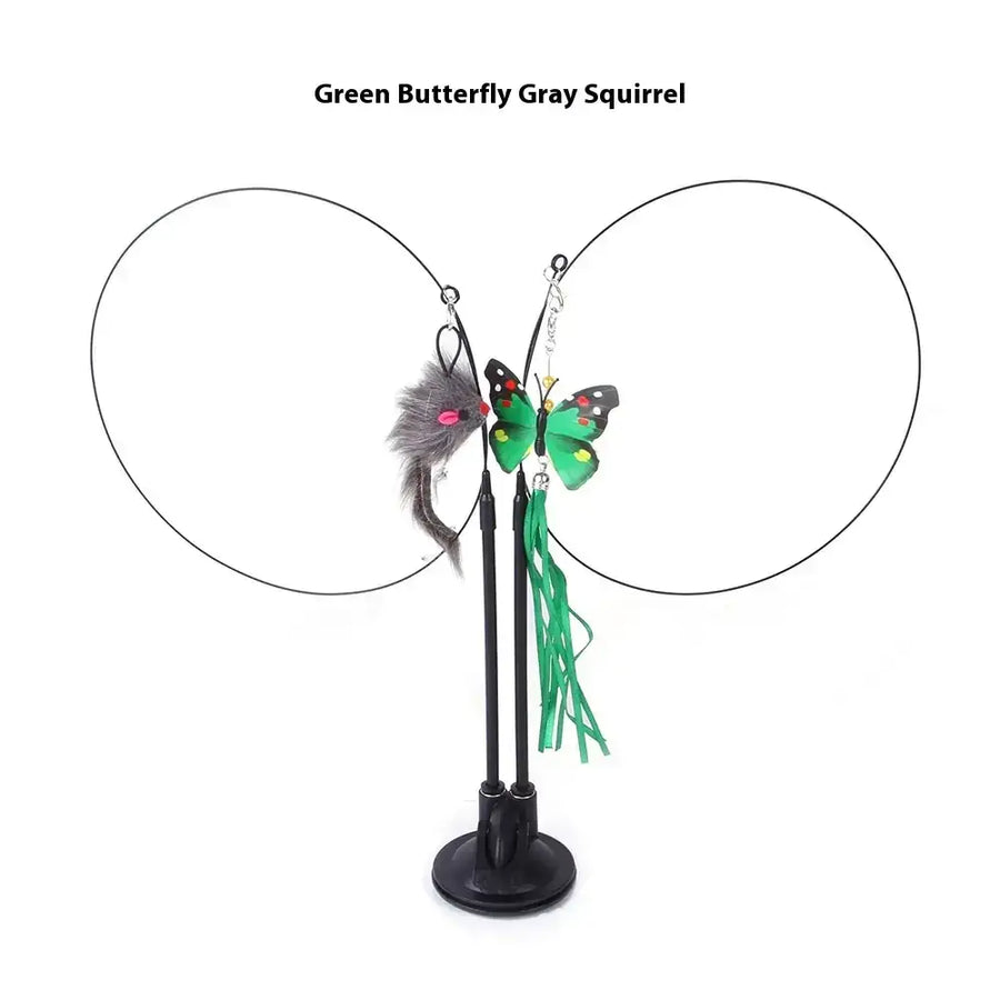 Green butterfly and gray squirrel cat toy with dangling feathers on a black stand.