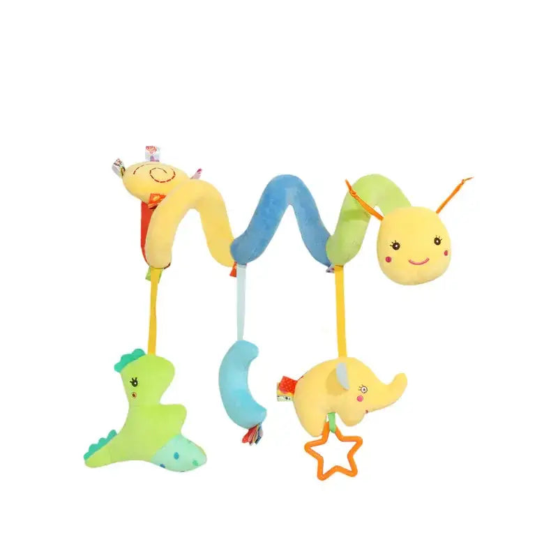 A colorful plush baby mobile featuring a yellow and blue segmented snake with smiling faces, hanging from which are soft stuffed animals including a green dinosaur, a light blue moon, and a yellow elephant holding an orange star.