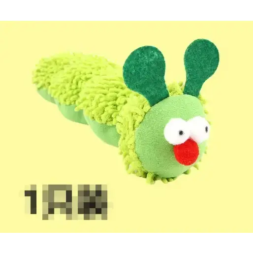 A plush green caterpillar toy with fuzzy texture, white eyes, and a red nose.