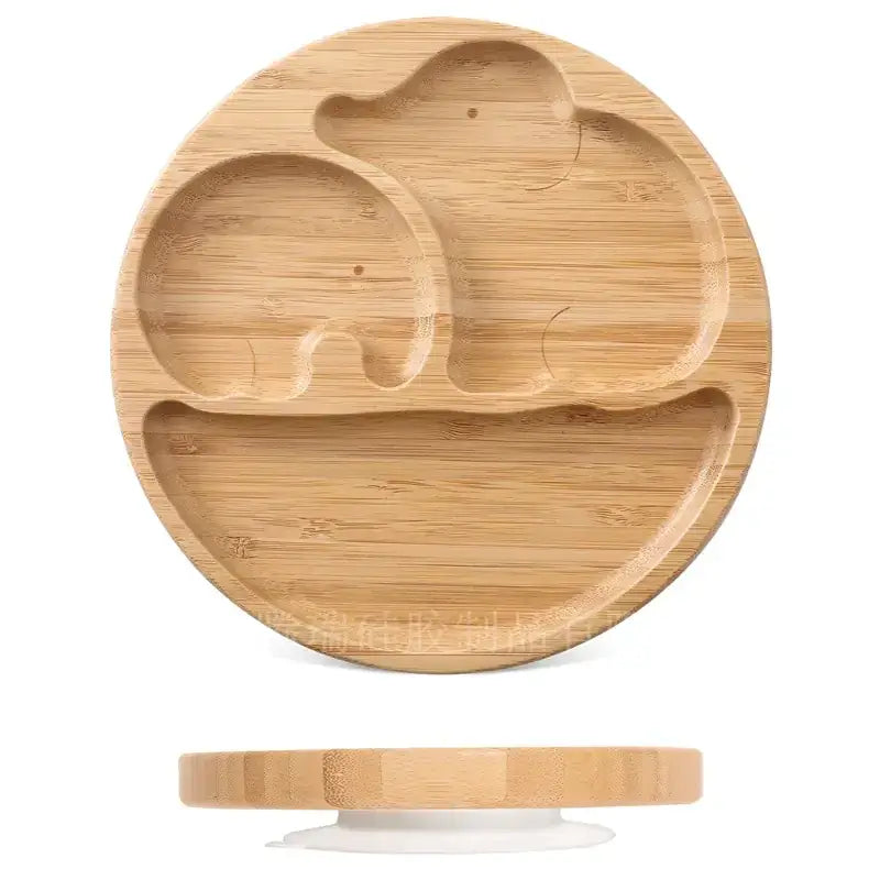 Light brown bamboo baby plate featuring two carved elephant shapes with a smooth, natural wood grain finish.