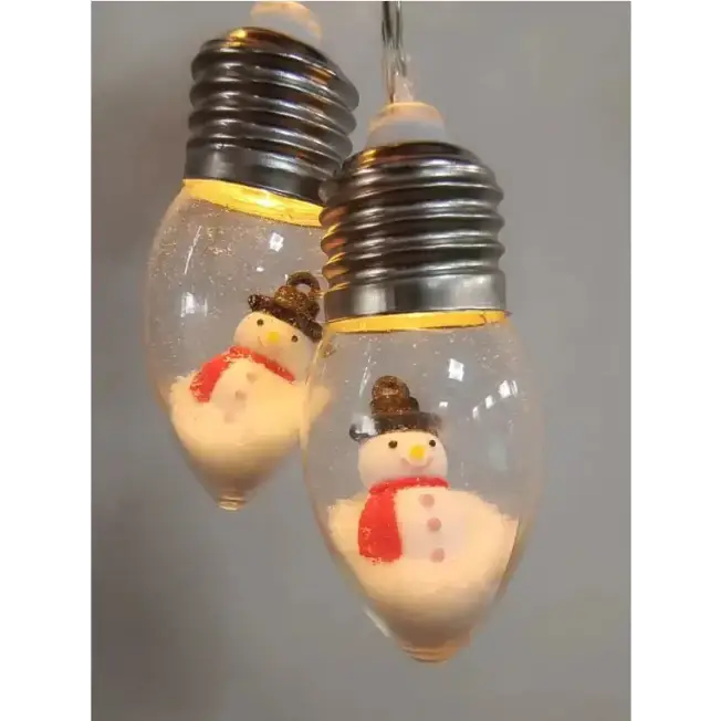 Clear glass light bulbs with silver screw bases, each containing a miniature snowman figurine wearing a brown hat and red scarf.
