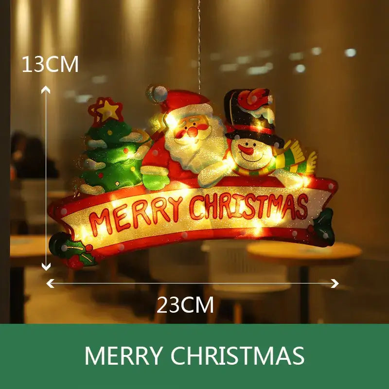 A festive illuminated christmas decoration featuring santa claus and a snowman with glowing lights, adorned in red and green colors.