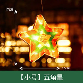 A glowing, five-pointed star-shaped christmas ornament with a red and green striped pattern and an illuminated center featuring santa claus.