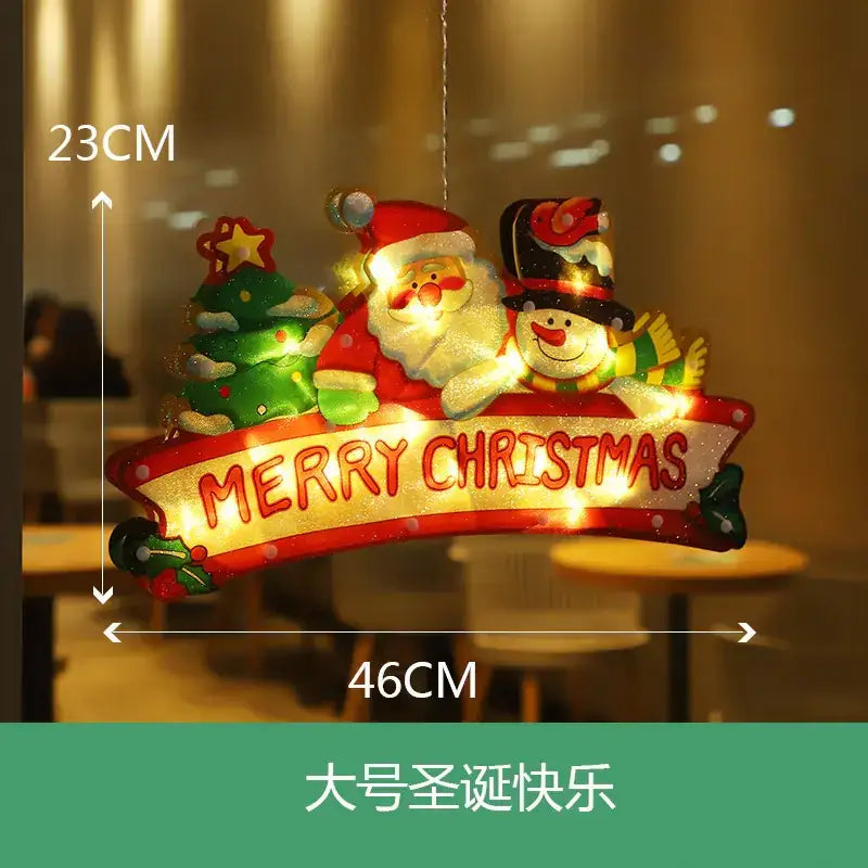 A festive illuminated christmas decoration featuring santa and a snowman with glowing lights, adorned in red and green colors.