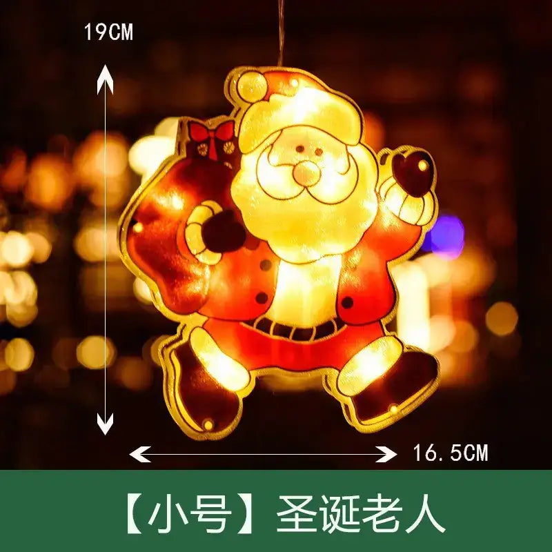 A glowing, illuminated santa claus ornament with a red suit and gold trim.