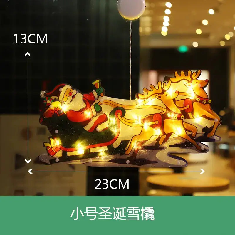 A festive illuminated santa claus sleigh with reindeer, crafted from translucent material and adorned with warm glowing lights.