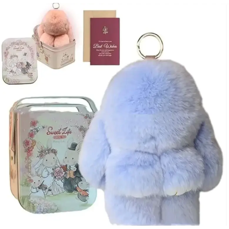 Light blue plush bunny keychain with a metallic ring attachment.