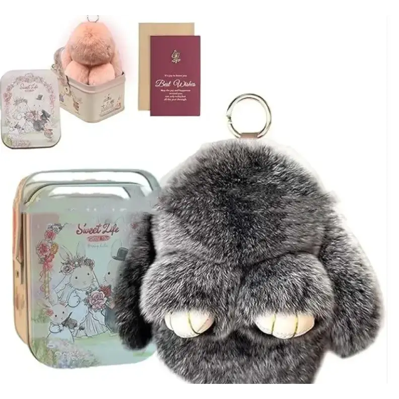 Gray plush bunny keychain with soft fur and white embroidered eyes.
