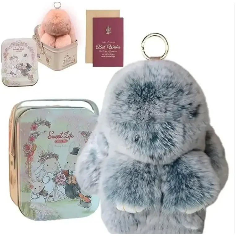 Fluffy gray plush bunny keychain with soft fur and white paw details.