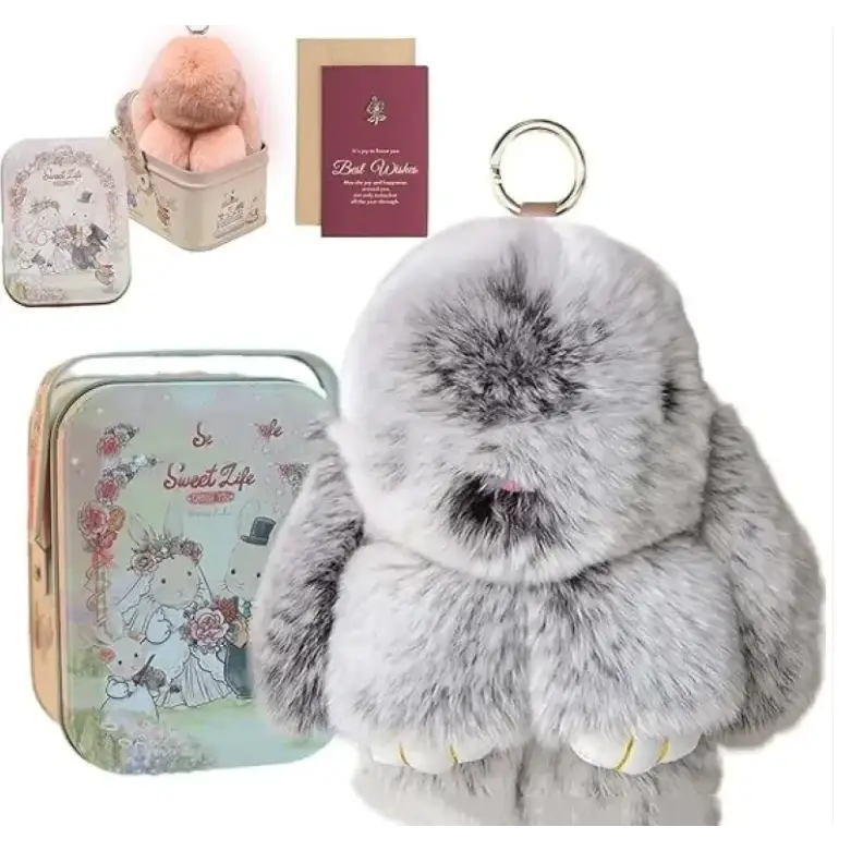 Gray faux fur bunny keychain with a metallic ring attachment.