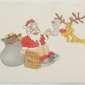 A festive christmas-themed paper napkin featuring a cartoon santa claus in his traditional red suit and hat, sitting on a brick chimney with a sack of gifts beside him, while a yellow reindeer with antlers and a red nose holds up a roll of