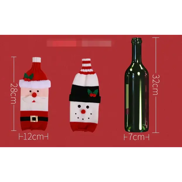 Red and white knitted wine bottle cover designed to resemble santa claus with a red hat, white beard, black belt, and green holly accents.