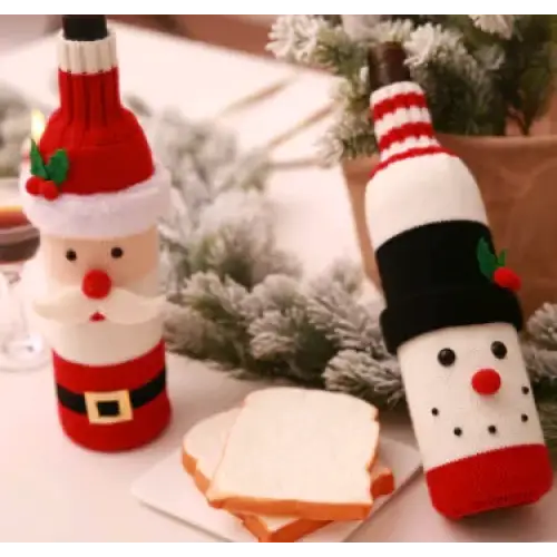 Red and white santa claus-themed wine bottle covers with black accents, featuring embroidered facial details.