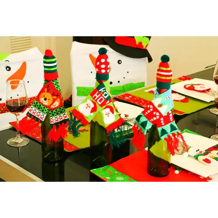 Christmas-themed knitted sweater bottle covers in red, green, and white with festive patterns like santa faces and candy canes.