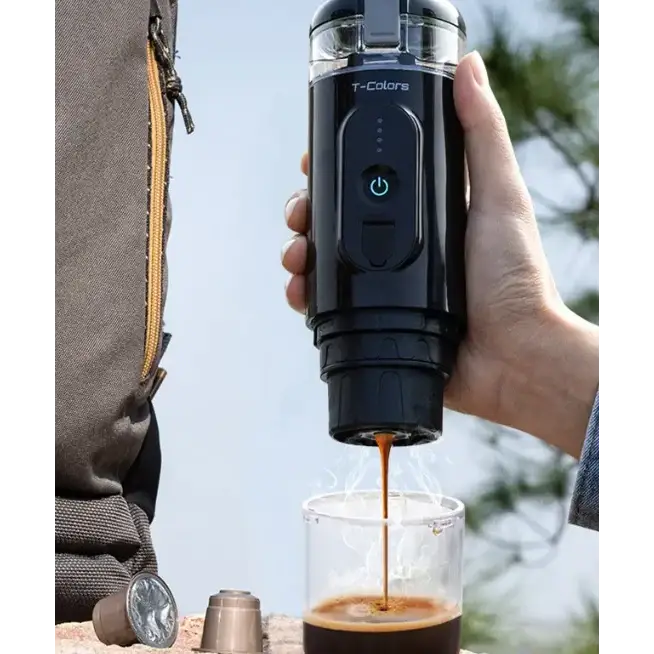 Black t-colors portable espresso maker with a transparent top and power button.