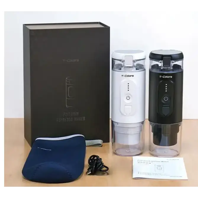 Two t-colors portable electric coffee makers, one white and one black, each with a clear cylindrical body and a power button on the side.