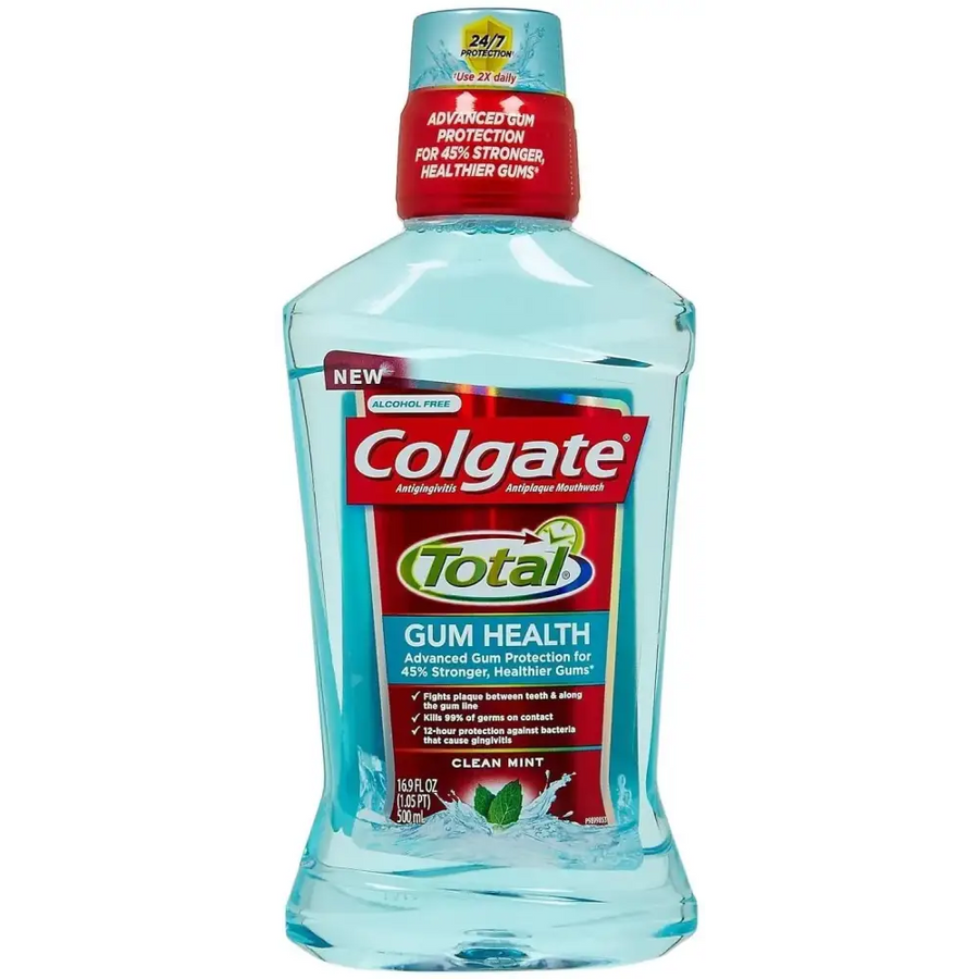 Clear blue colgate total gum health mouthwash in a transparent bottle with red and white labeling.