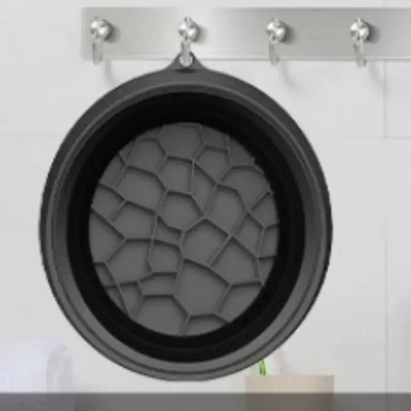 Black silicone collapsible pot with a honeycomb pattern interior