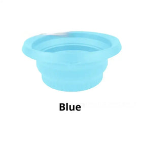 A light blue, collapsible silicone bowl with a smooth, flexible surface and concentric ridges.