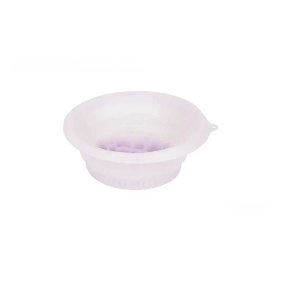 A translucent lavender silicone bowl with a flexible, collapsible design and a small handle on the side.
