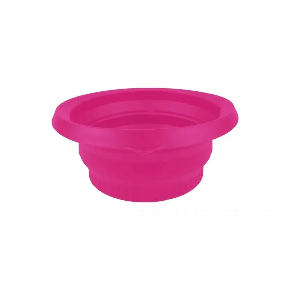 A vibrant pink collapsible silicone bowl with a ribbed texture and flared rim.