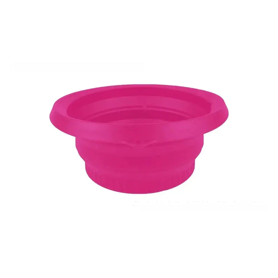 A vibrant pink collapsible silicone bowl with a ribbed texture and flared rim.