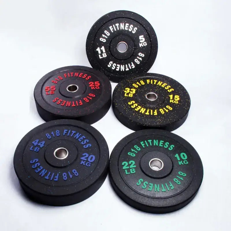 Black rubber weight plates with colorful printed markings for different weights, branded ’818 fitness’.