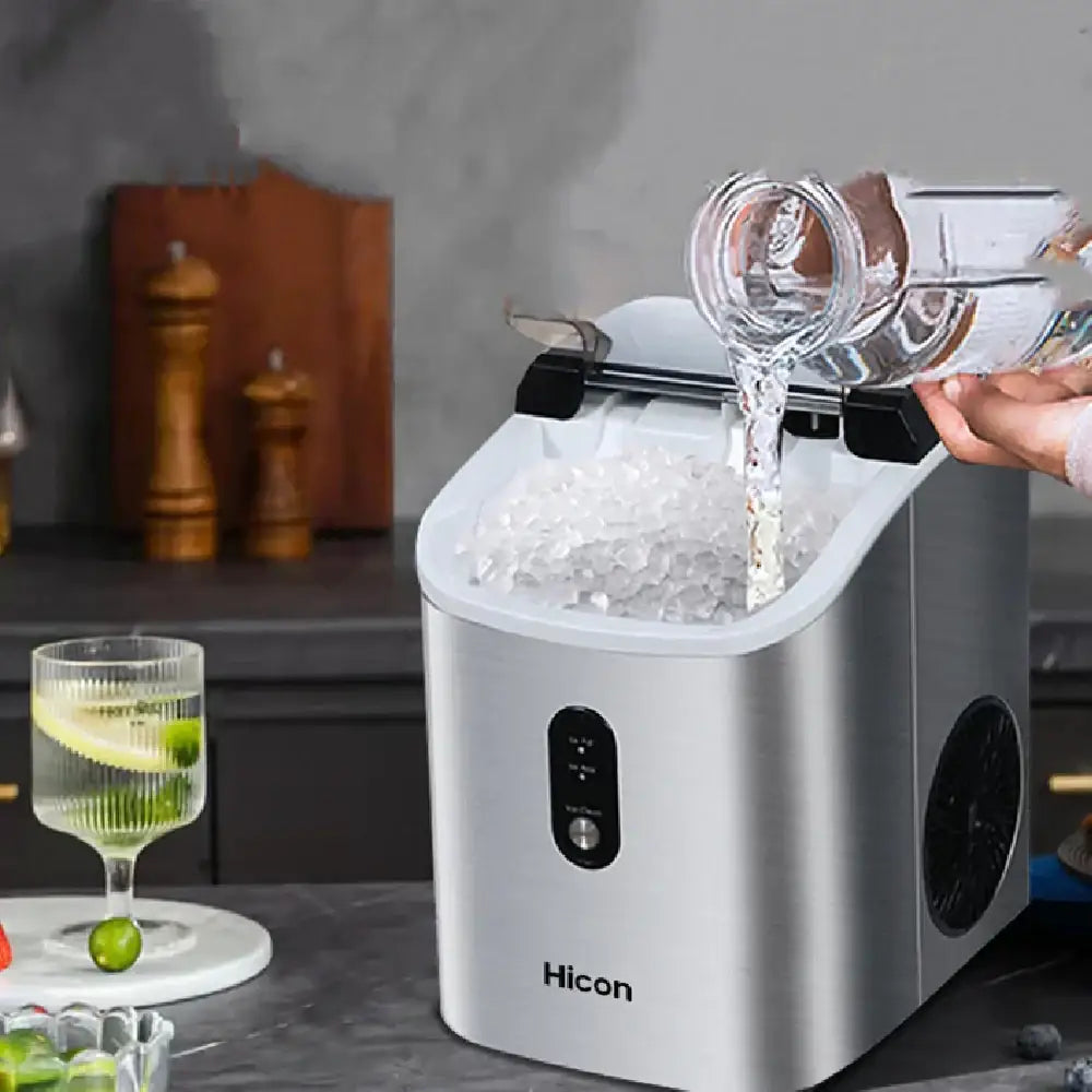Silver hicon countertop ice maker with a sleek, modern design and black control panel.