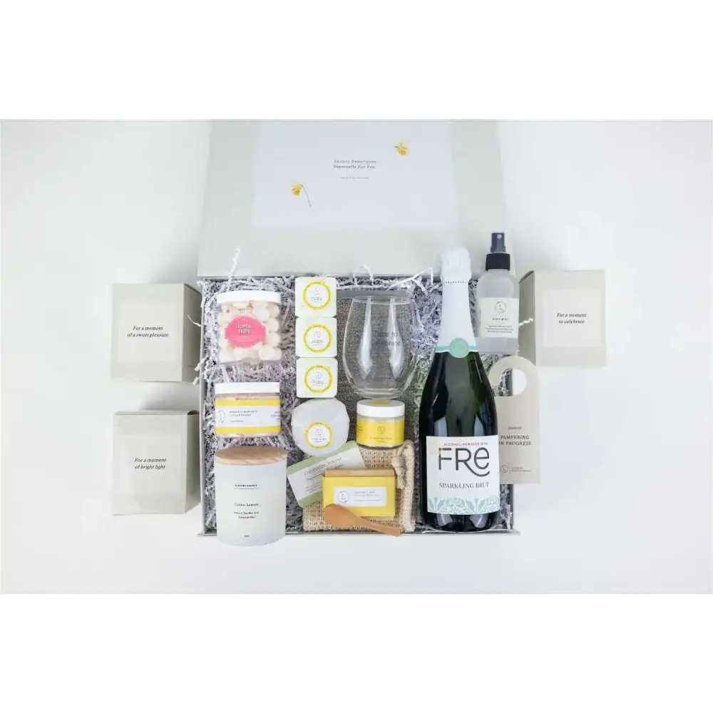 A dark green bottle of fre sparkling fruit wine with a white label and silver foil cap.