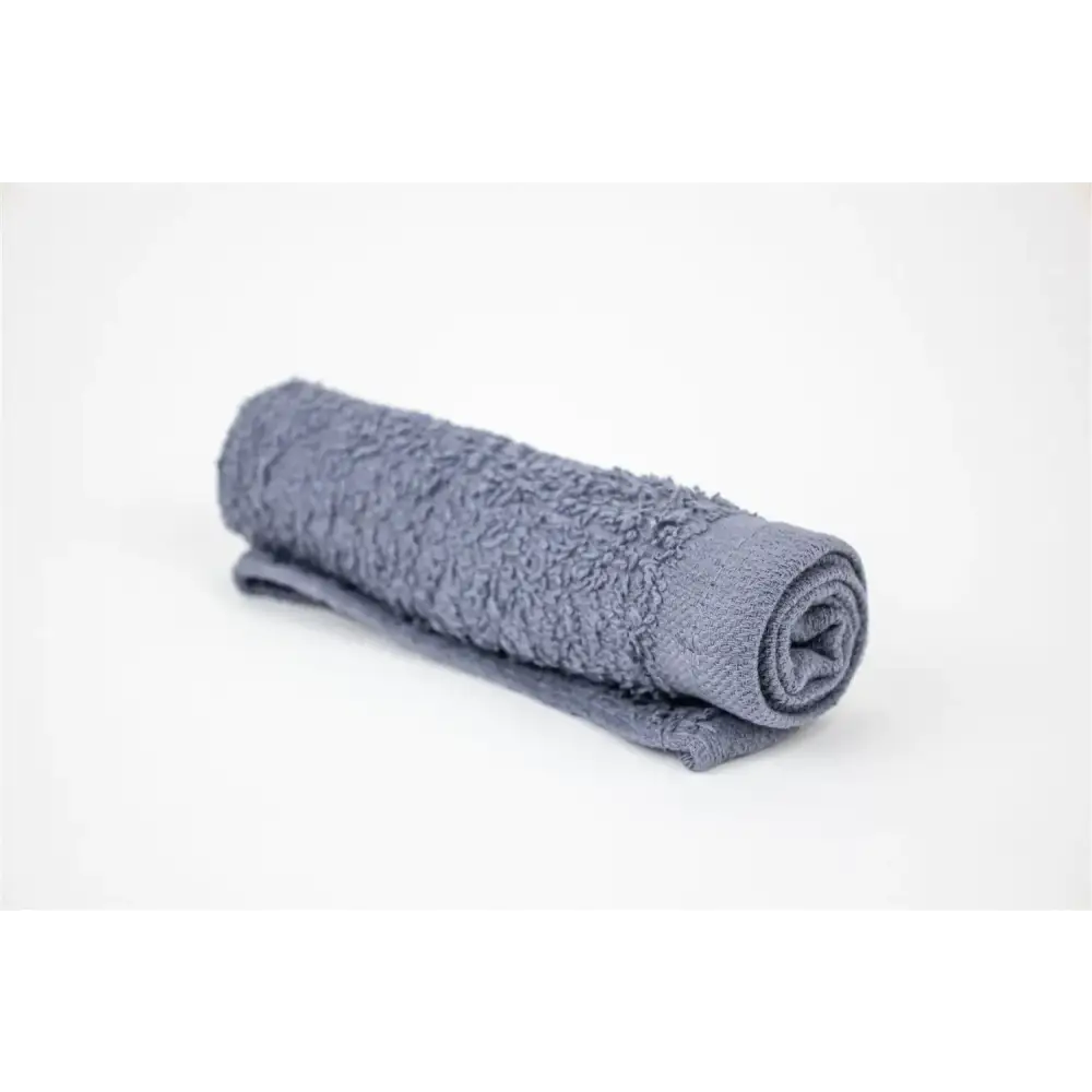 A neatly rolled gray terry cloth towel with a soft, plush texture.